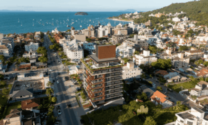 Vista aérea do empreendimento Meraki Allure Jurerê próximo à praia em Florianópolis.