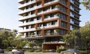 Fachada diurna com arquitetura moderna de lançamento imobiliário em Jurerê Internacional.