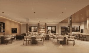 Salão de festas adulto completo com mesas para convidados, ilha gourmet e lounge integrado.
